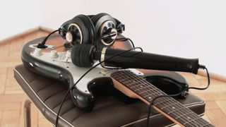 Sound installation, a composition for electric guitar, vibrator, and voice, and a recording of its performance