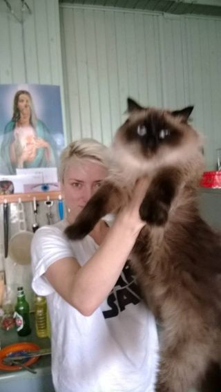 Dj Sporty Spice, one of the founding member of the Wixapol collective and her cat, Tundra.